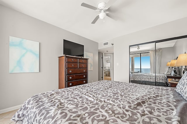 tiled bedroom with access to exterior, visible vents, and a ceiling fan