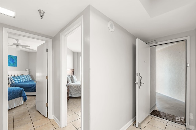 hallway with light tile patterned floors