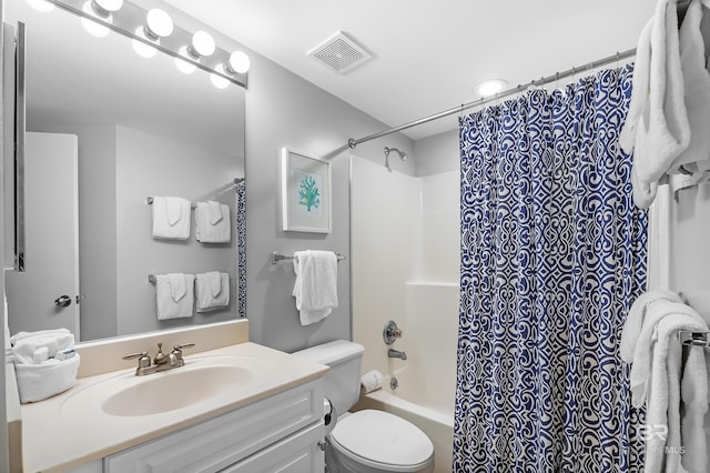 full bathroom with toilet, vanity, visible vents, and shower / tub combo with curtain