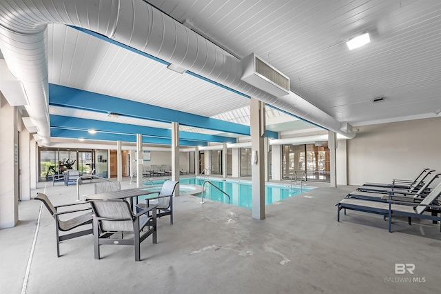 community pool featuring a patio area