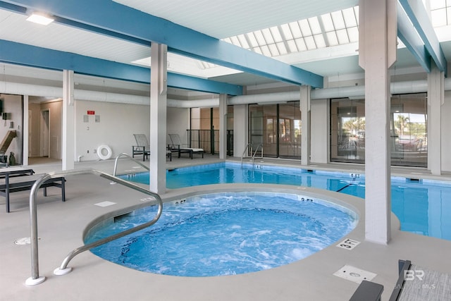 community pool featuring a patio and an indoor in ground hot tub