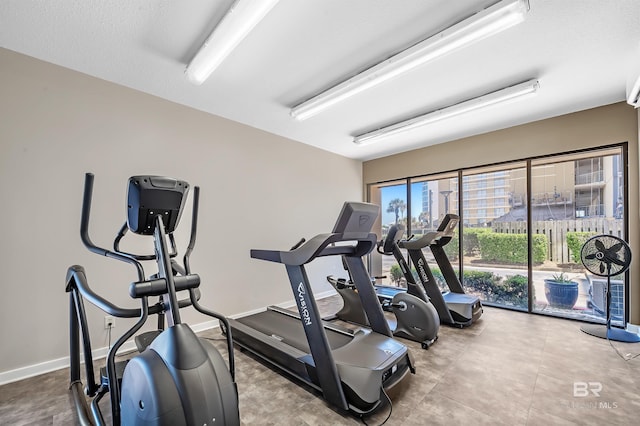 exercise room featuring baseboards