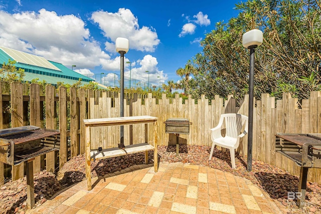 view of patio / terrace featuring fence