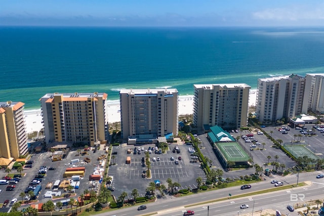 birds eye view of property featuring a water view and a view of city