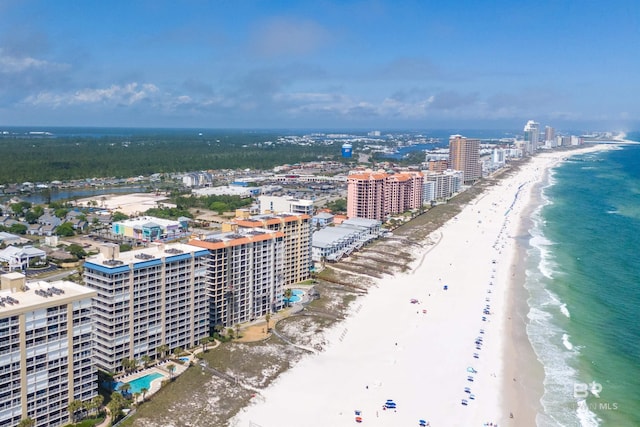 birds eye view of property featuring a view of the beach, a water view, and a view of city