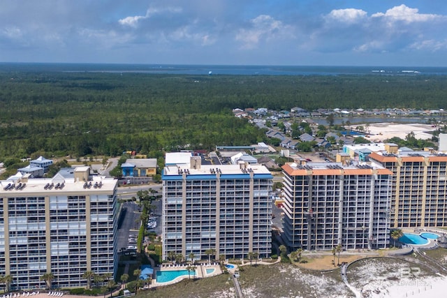 drone / aerial view featuring a forest view