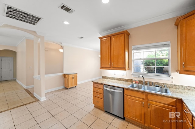 kitchen featuring light tile patterned floors, sink, stainless steel dishwasher, crown molding, and ornate columns