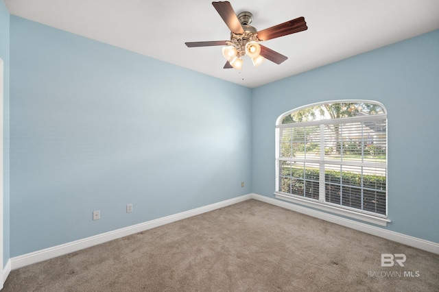 carpeted empty room with ceiling fan