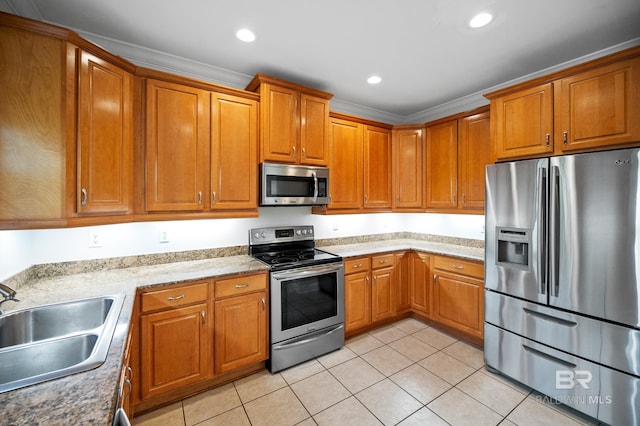 kitchen featuring light tile patterned flooring, appliances with stainless steel finishes, crown molding, and sink