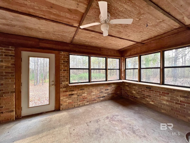 unfurnished sunroom featuring ceiling fan