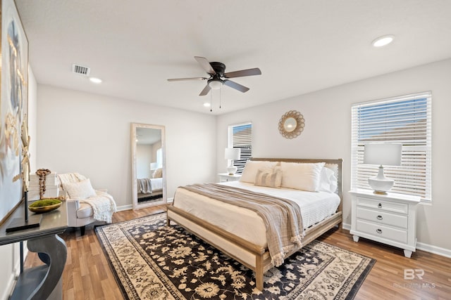 bedroom featuring ceiling fan and light hardwood / wood-style flooring