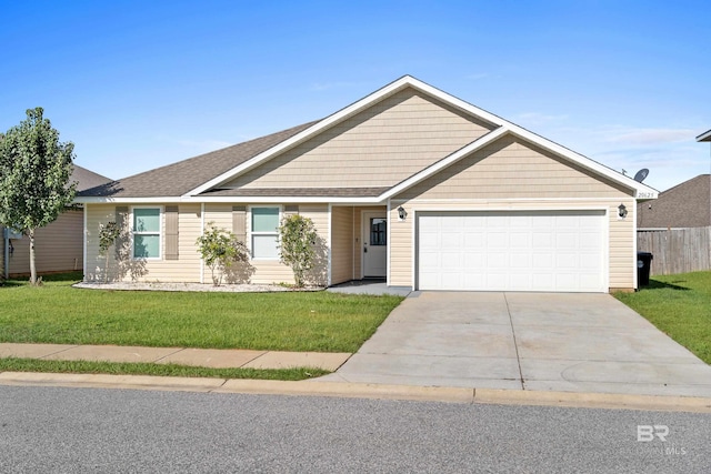 single story home featuring a garage and a front lawn