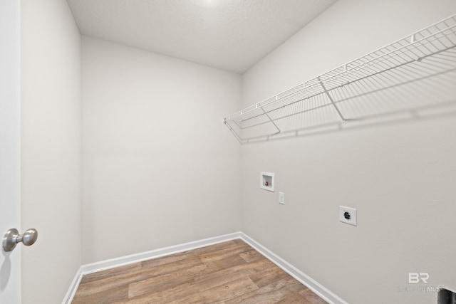 laundry room featuring hookup for a washing machine, electric dryer hookup, and hardwood / wood-style floors