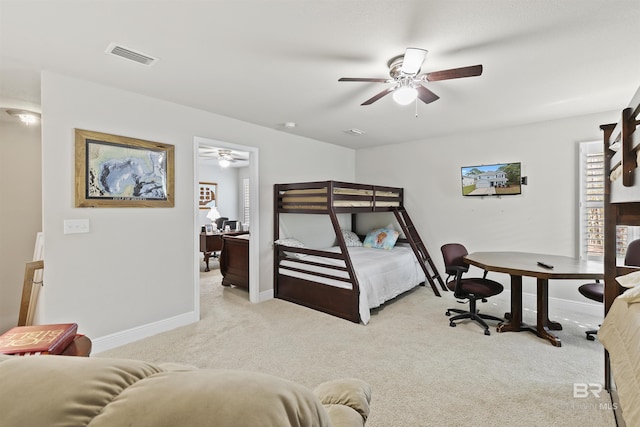 bedroom featuring ceiling fan and light carpet