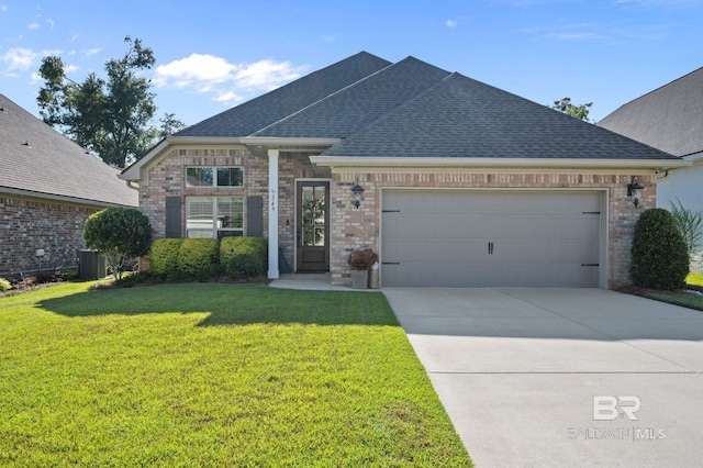 view of front facade with cooling unit, a garage, and a front lawn