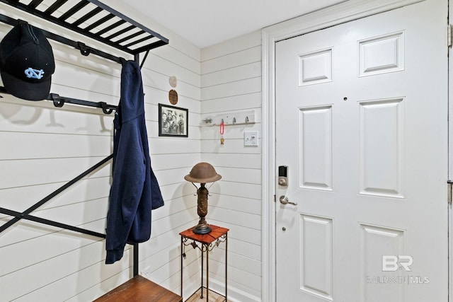 interior space featuring wood walls and hardwood / wood-style flooring