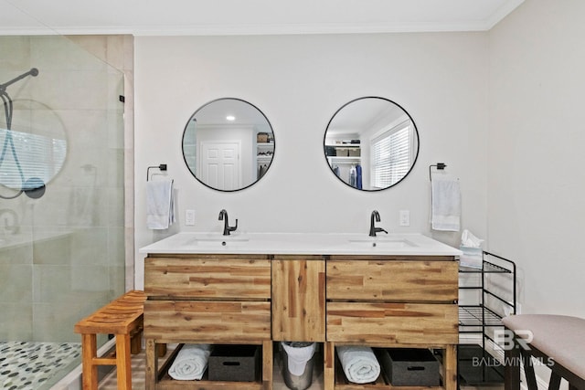 bathroom featuring vanity, crown molding, and a shower with shower door