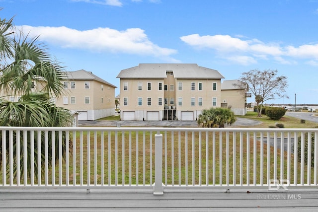 wooden deck featuring a yard