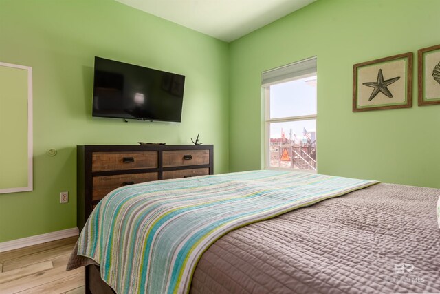 2802 Bienville Blvd, Dauphin Island, AL 36528 - bedroom with baseboards and wood finished floors