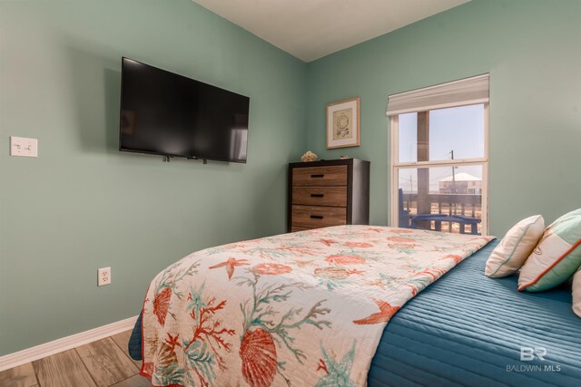 2802 Bienville Blvd, Dauphin Island, AL 36528 - bedroom featuring baseboards and wood finished floors