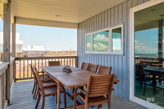 2802 Bienville Blvd, Dauphin Island, AL 36528 - wooden terrace featuring outdoor dining space