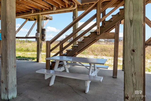 2802 Bienville Blvd, Dauphin Island, AL 36528 - view of community featuring a patio and stairs