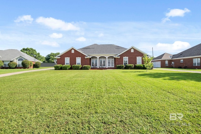 9554 Tunbridge Ct, Mobile, AL 36695 - traditional home featuring french doors, a front yard, and brick siding