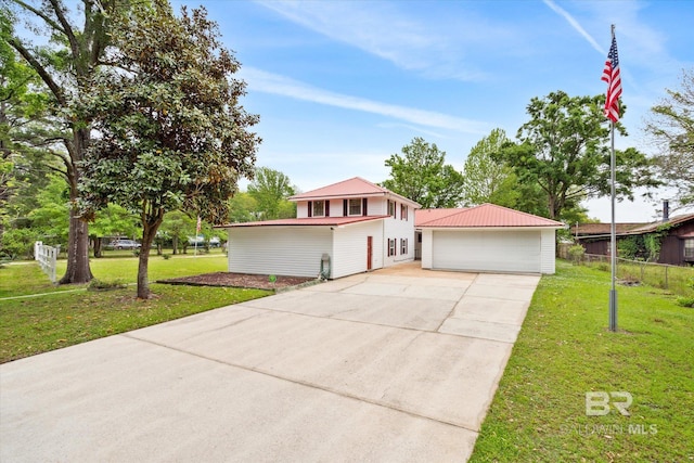 view of front facade featuring a garage and a front lawn