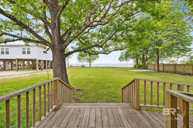 wooden deck featuring a yard