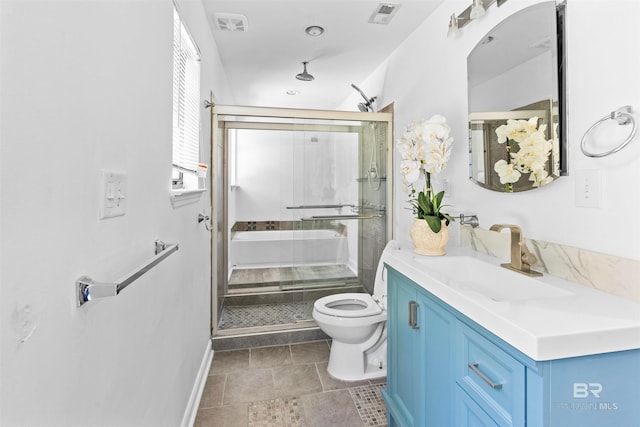 bathroom with toilet, tile patterned floors, and vanity