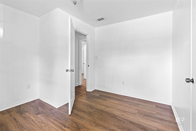 empty room with wood-type flooring