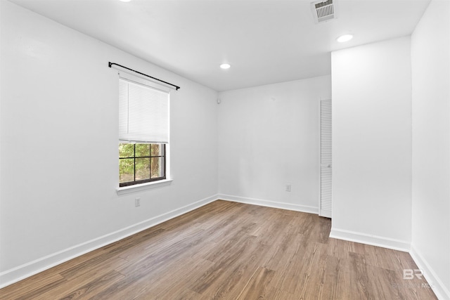 spare room with light hardwood / wood-style flooring