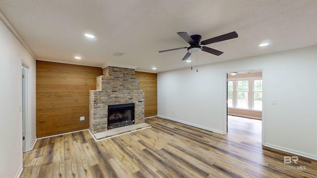 7770 Simmons Dr, Foley, AL 36535 - unfurnished living room with recessed lighting, wood finished floors, a ceiling fan, a fireplace, and baseboards