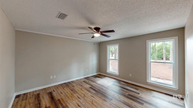 7770 Simmons Dr, Foley, AL 36535 - unfurnished room with wood finished floors, baseboards, ceiling fan, and a textured ceiling