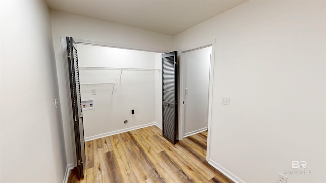 7770 Simmons Dr, Foley, AL 36535 - unfurnished bedroom with light wood-type flooring, a closet, and baseboards