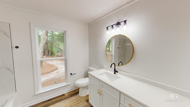 7770 Simmons Dr, Foley, AL 36535 - bathroom featuring toilet, a textured ceiling, wood finished floors, vanity, and a shower