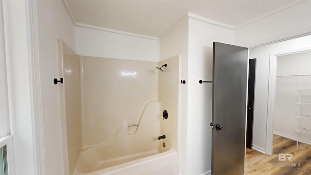 7770 Simmons Dr, Foley, AL 36535 - bathroom with wood finished floors and shower / washtub combination
