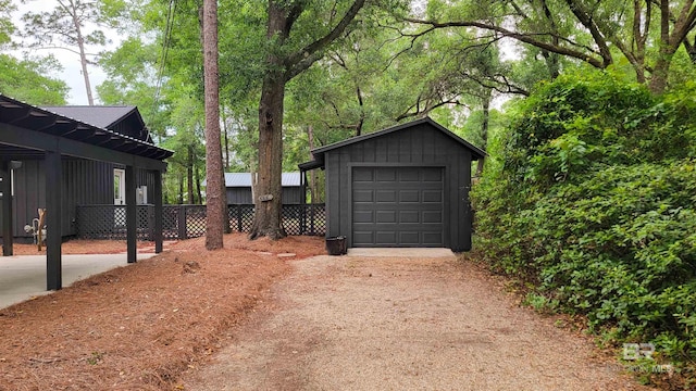 7770 Simmons Dr, Foley, AL 36535 - detached garage featuring fence and driveway