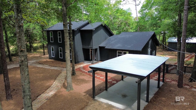 7770 Simmons Dr, Foley, AL 36535 - view of front of home with a shingled roof and a patio area