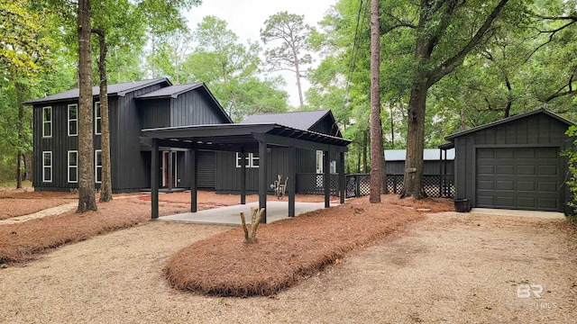 7770 Simmons Dr, Foley, AL 36535 - view of side of home featuring dirt driveway, board and batten siding, an outbuilding, and fence