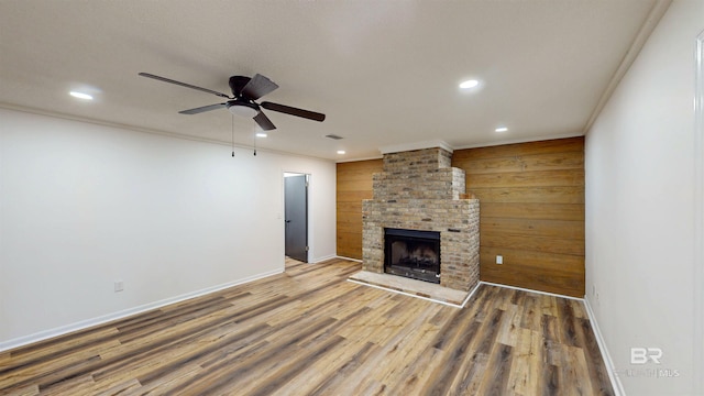 7770 Simmons Dr, Foley, AL 36535 - unfurnished living room with ceiling fan, recessed lighting, baseboards, wood finished floors, and a brick fireplace