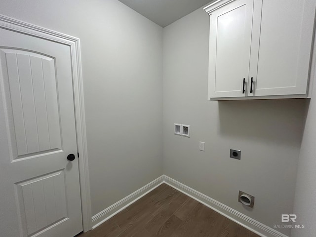 laundry room with electric dryer hookup, washer hookup, dark hardwood / wood-style flooring, and cabinets