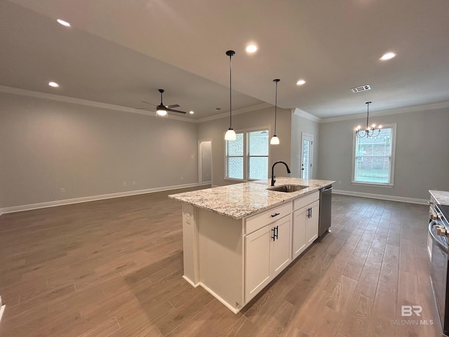 kitchen with sink, light stone counters, stainless steel dishwasher, a kitchen island with sink, and white cabinets