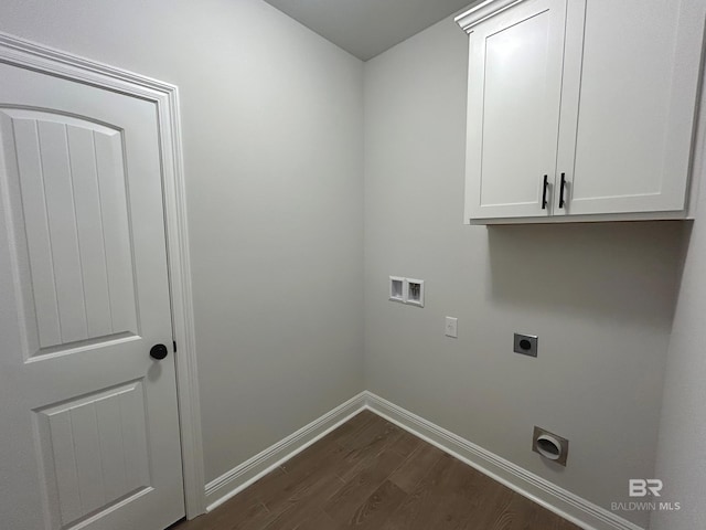 washroom with electric dryer hookup, dark wood finished floors, baseboards, cabinet space, and hookup for a washing machine