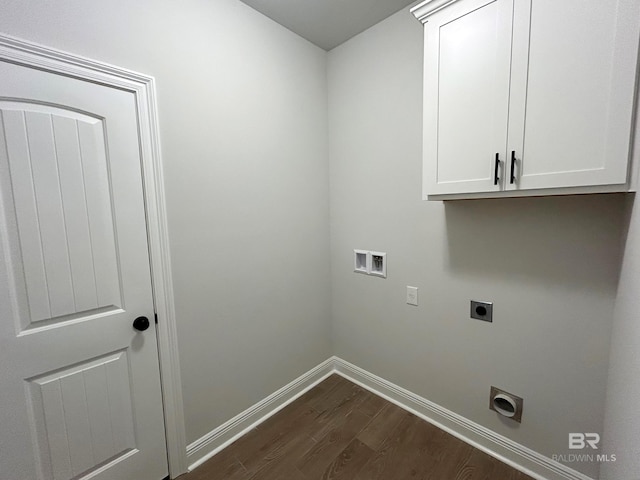 laundry room with dark wood-style flooring, hookup for a washing machine, baseboards, electric dryer hookup, and cabinet space
