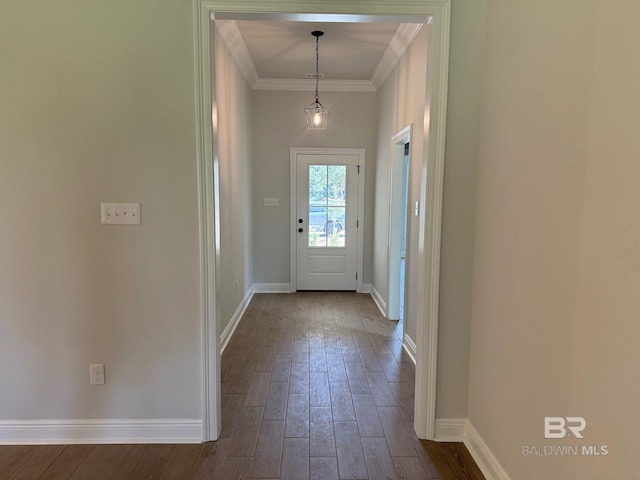 entryway featuring wood-type flooring and ornamental molding