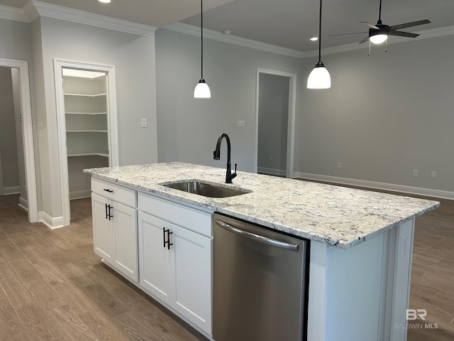 kitchen featuring pendant lighting, sink, dishwasher, white cabinetry, and an island with sink