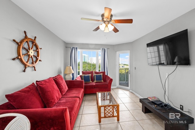 tiled living room with ceiling fan