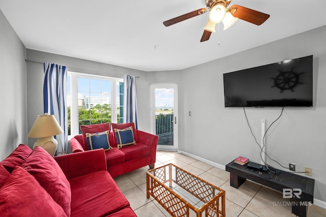 living room with ceiling fan and light tile patterned floors