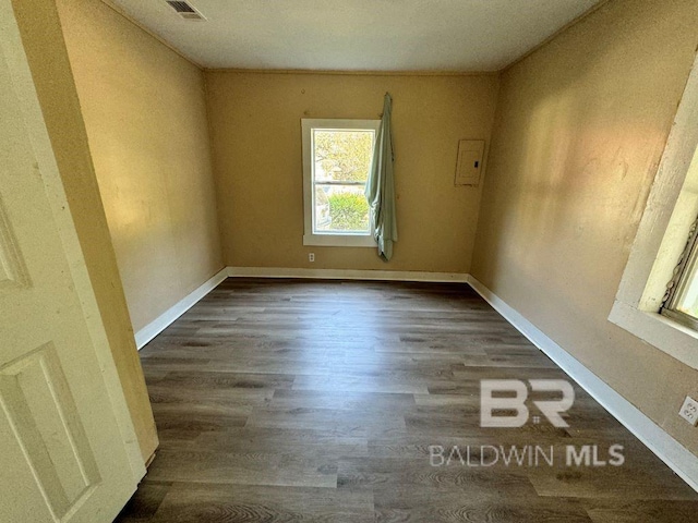 unfurnished room featuring dark hardwood / wood-style flooring